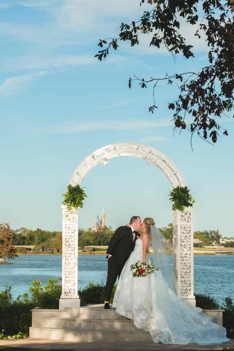 Disney bride and groom kiss