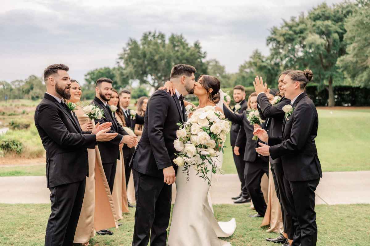 bride and groom kiss