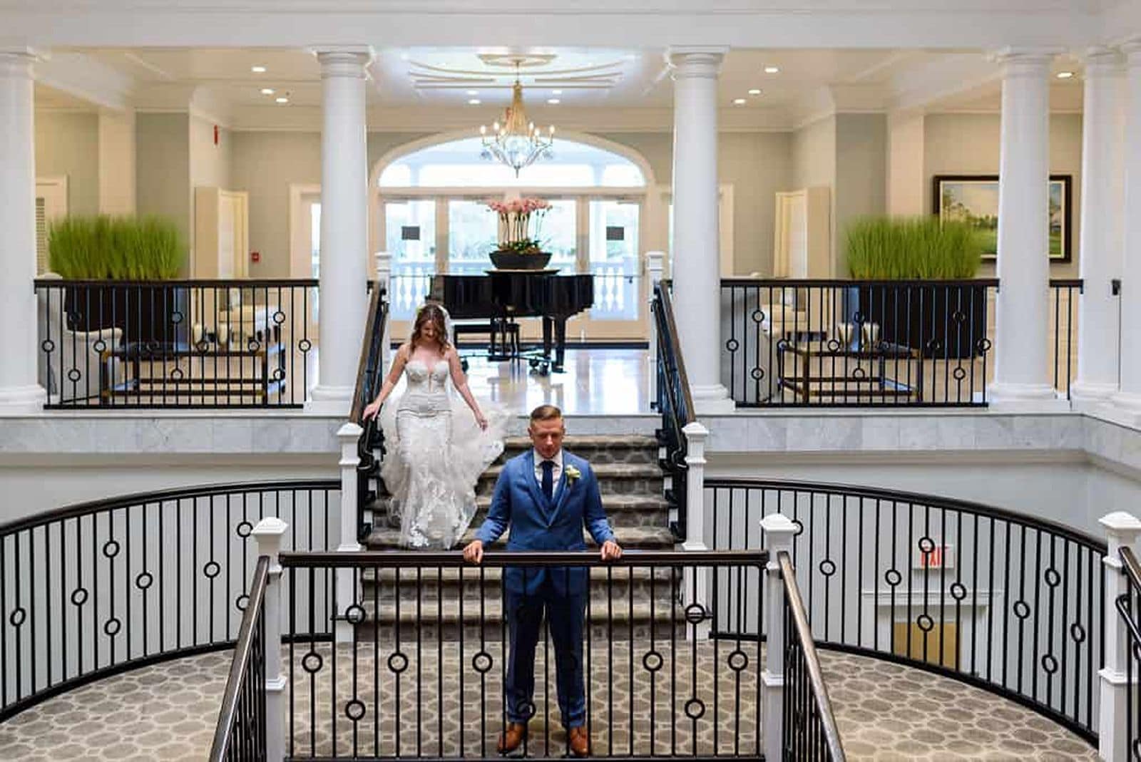 Orlando couple posing on country club staircase